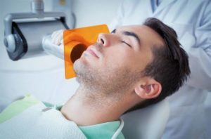 man sedated during dental procedure